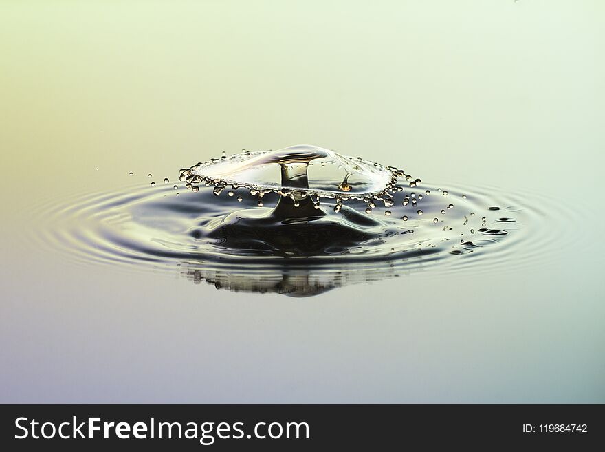 Abstract background of splash of water with paints, a crown of liquid, collision of drops, the concept art. Abstract background of splash of water with paints, a crown of liquid, collision of drops, the concept art