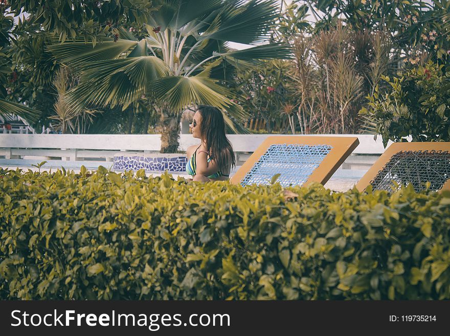 Woman Wearing Teal Bikini Top