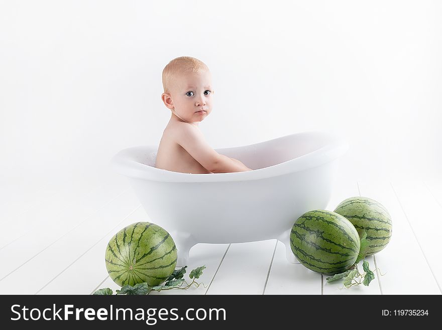 Photography of Baby On Bathtub