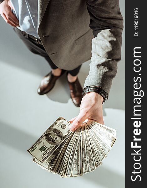 Close-up view of businessman holding money in hand