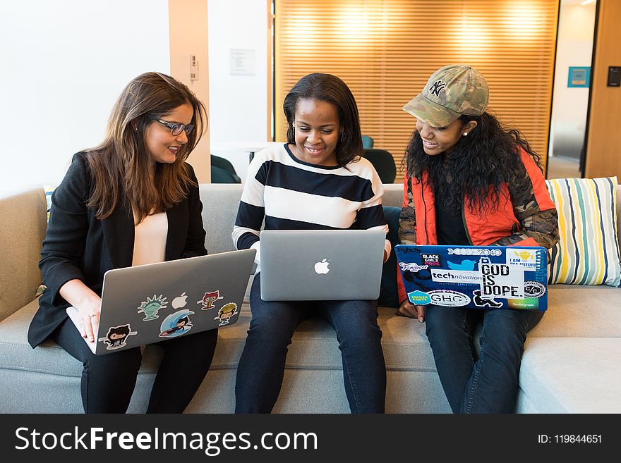 Three Woman In Front Of Laptop Computer