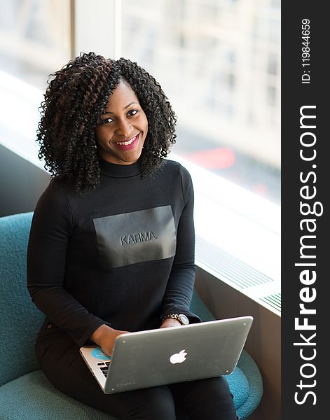 Woman Wearing Black Sweatshirt Using Silver Macbook