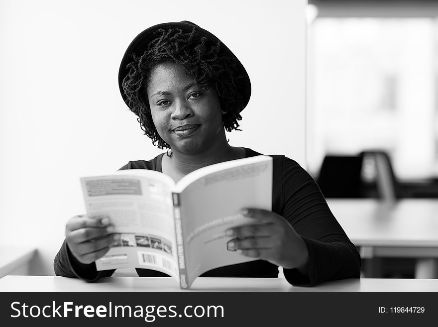 Monochrome Photography of Woman Reading Book