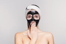 Young Girl With Purifying Black Face Mask Royalty Free Stock Photo
