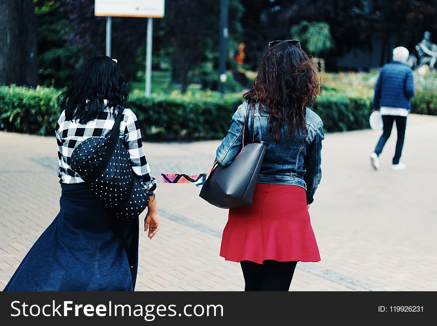 Woman In Blue Denim Jacket And Red Skirt