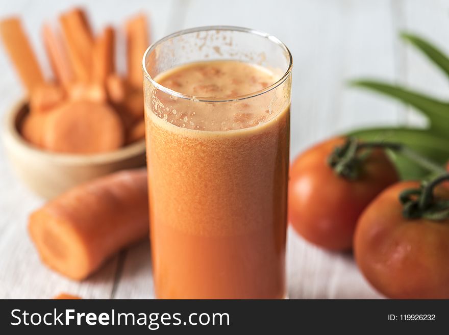Tomatoes and Carrot Juice on Highball Glass
