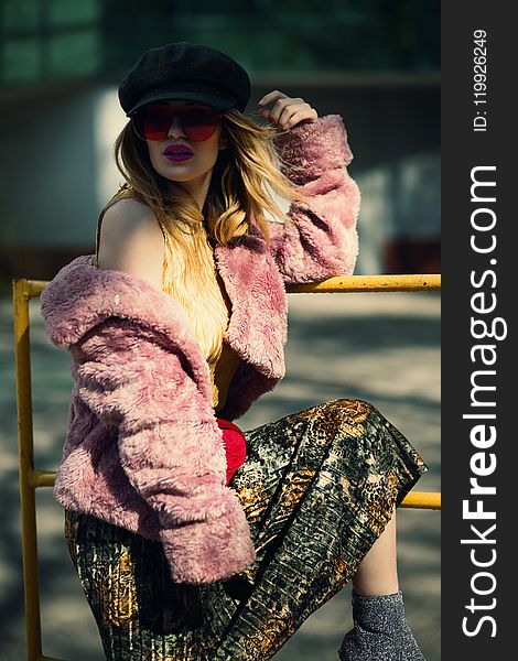 Shallow Focus Photography of Woman in Pink Sheepskin Coat