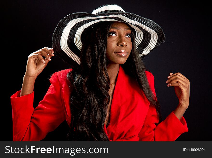 Woman in Black and White Striped Sun Hat