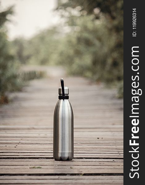 Vacuum Flask On Brown Wooden Dock