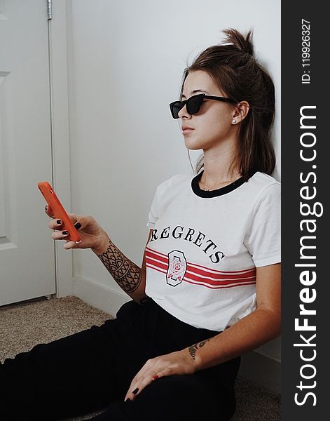 Woman Wearing Black Sunglasses Holding Android Smartphone