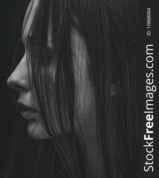 Grayscale Photo of hair partially covering girl&#x27;s face