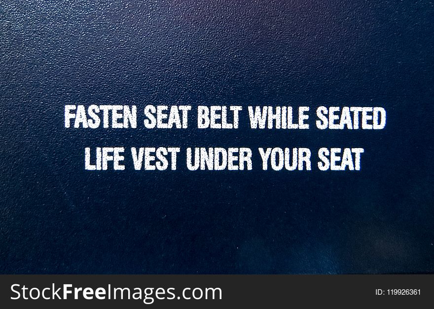Fasten Seat Belt While Seated Life Vest Under Your Seat Text Overlay