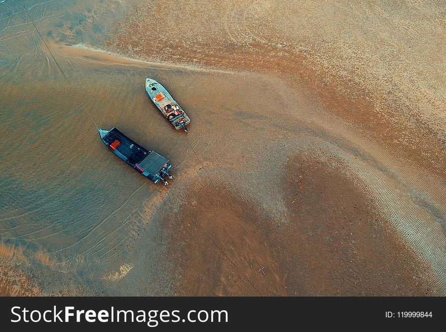 Bird&x27;s-eye View Of Two Boats On Water Near Shore