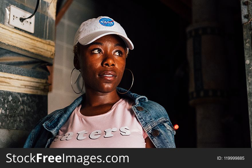 Woman Wearing White Cap And Pink Crew-neck Shirt