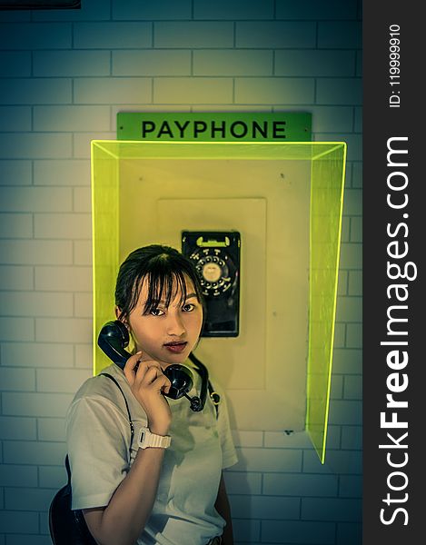 Woman at the Payphone