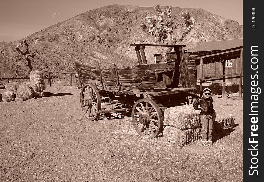 THIS IS MY SON MATTHEW STANDING NEXT TO A BAIL OF HAY IN A GHOST TOWN IN CALIFORNIA. THIS IS MY SON MATTHEW STANDING NEXT TO A BAIL OF HAY IN A GHOST TOWN IN CALIFORNIA.