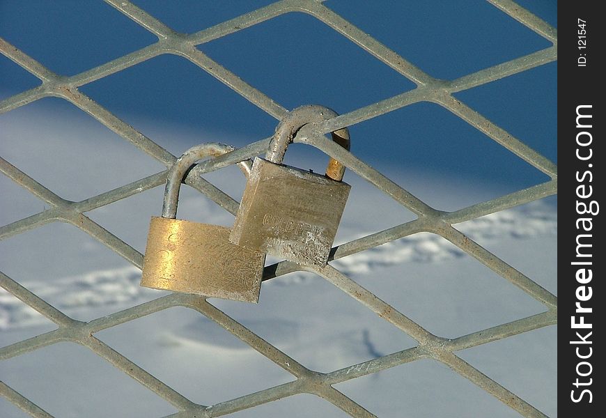 Customary (Estonian tradition) pair of wedding padlocks on the guard-rail of the bridge. Customary (Estonian tradition) pair of wedding padlocks on the guard-rail of the bridge