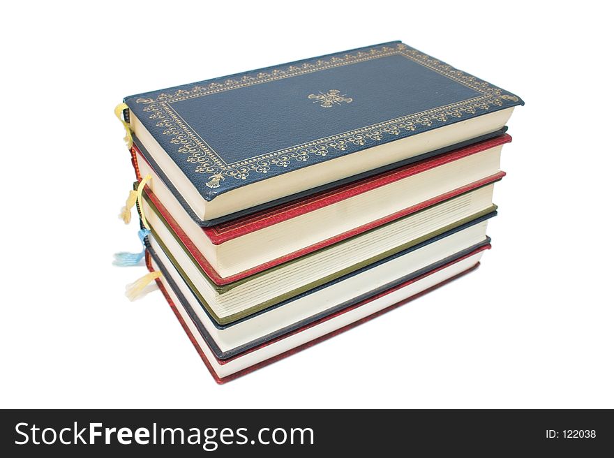 Stack of colourful old books - white background