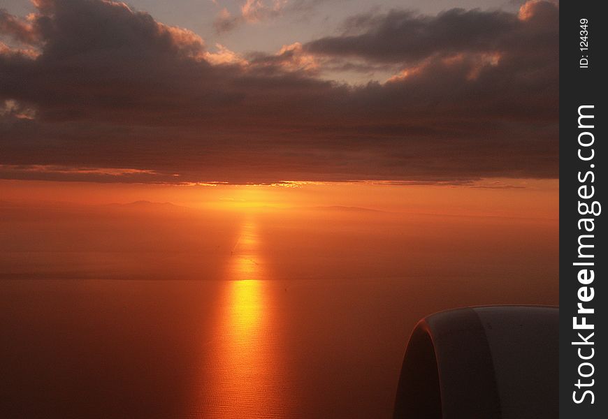 Sunset behind the clouds on my climb out of Istanbul. Reflexion on the Sea of Marmara. Sunset behind the clouds on my climb out of Istanbul. Reflexion on the Sea of Marmara.