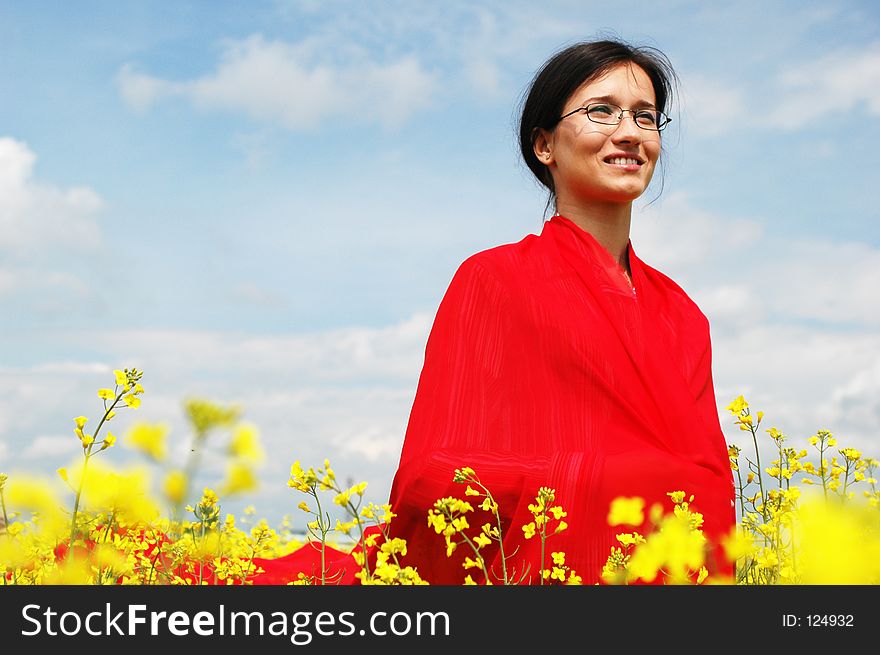 Girl with asian clothes, standing on ground. great color contrast