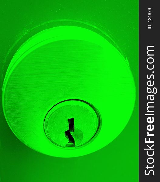 Closeup of a green lock faceplate. Closeup of a green lock faceplate