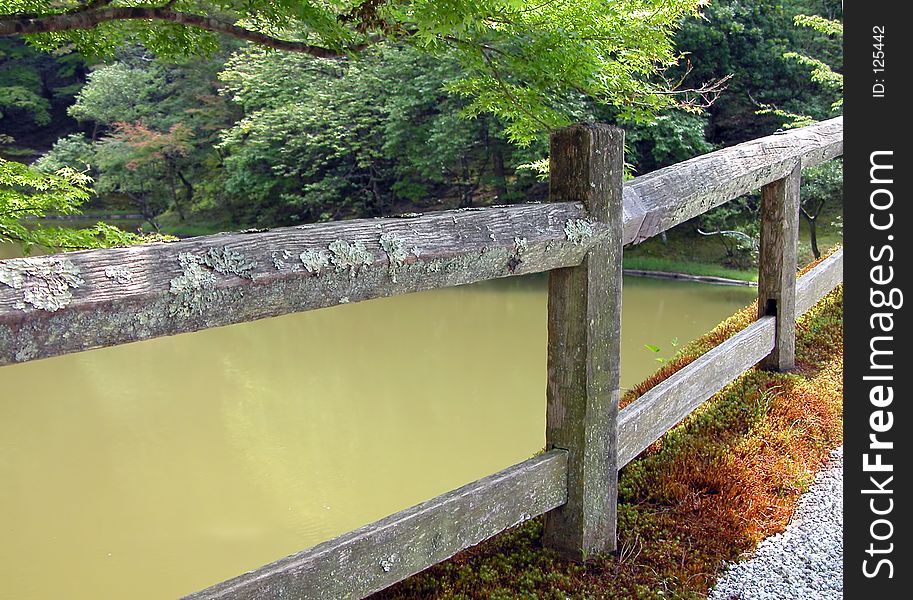 Interesting detail and perspective with an old Japanese wooden bridge in Shyugakuin Imperial Villa,Kyoto,Japan. Interesting detail and perspective with an old Japanese wooden bridge in Shyugakuin Imperial Villa,Kyoto,Japan