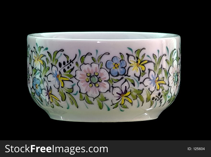 Small cup with flower dawings over black