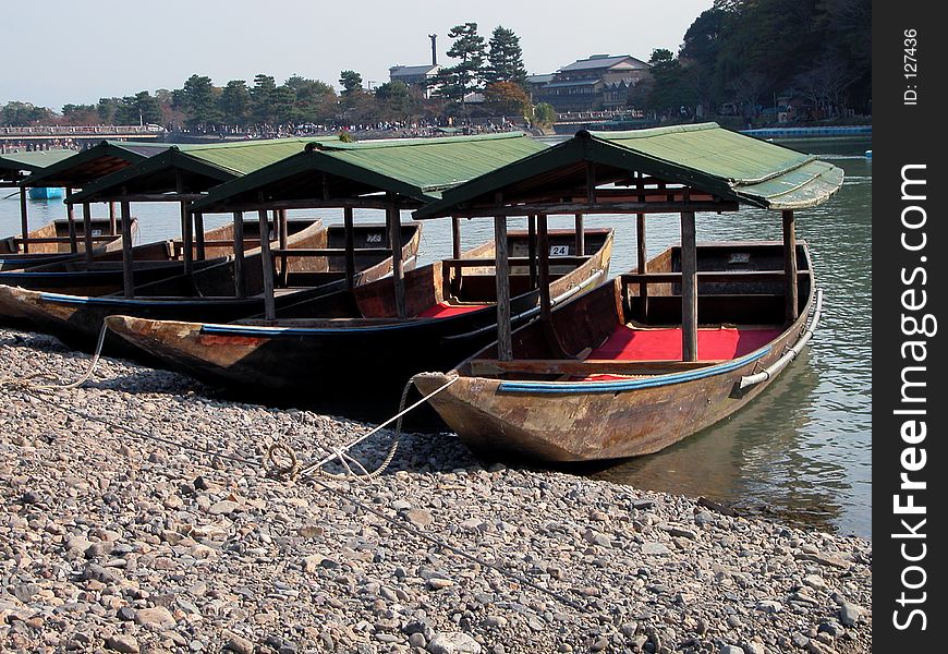 Some traditional boats on the riverside in a touristic area from Kyoto,Japan