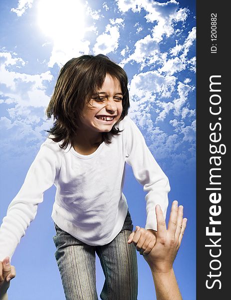 Little girl jumping high over blue sky. Little girl jumping high over blue sky