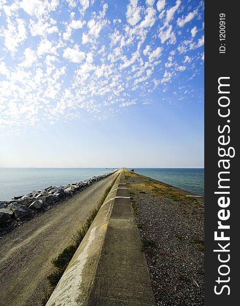 Path in the ocean with clouds