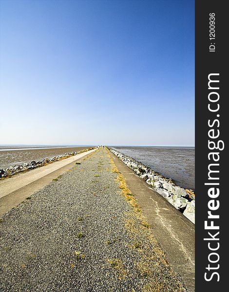 Long path over blue sky