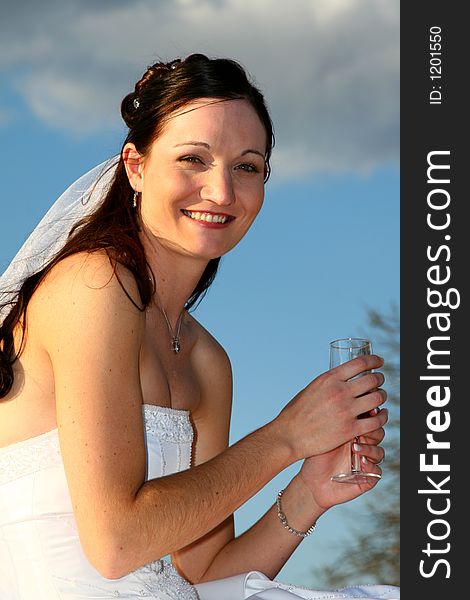 Bride drinking a glass of champaign. Bride drinking a glass of champaign