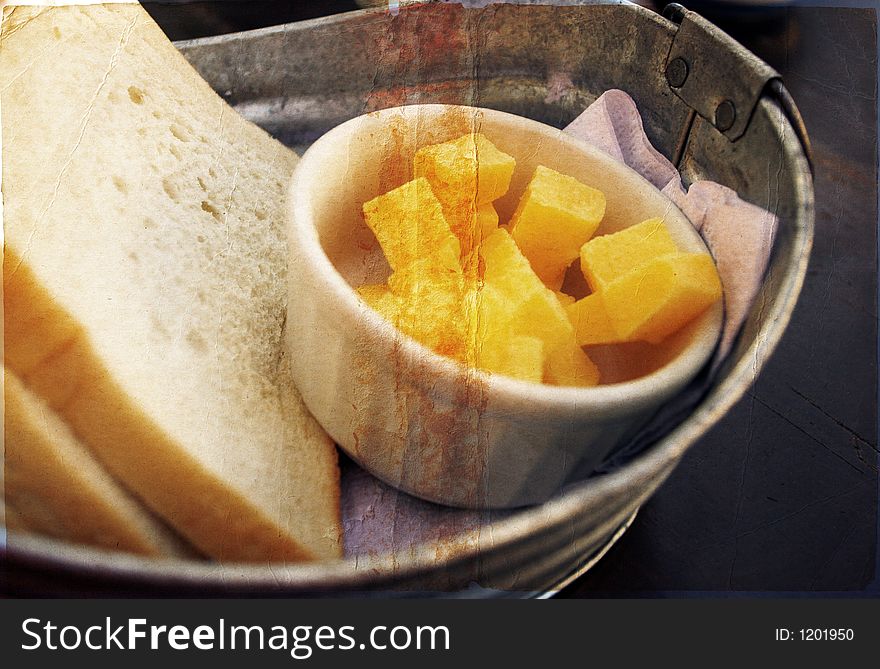 Home-made bread and butter in a zinc bowl. Home-made bread and butter in a zinc bowl