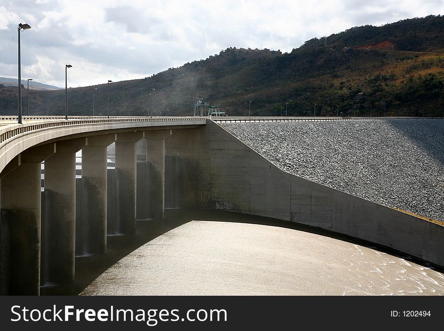 Road bridge going over riverbank. Road bridge going over riverbank