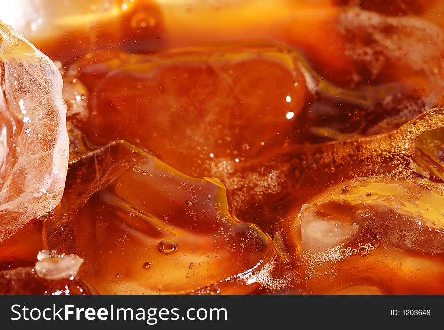 Water splash in drink with ice cubes