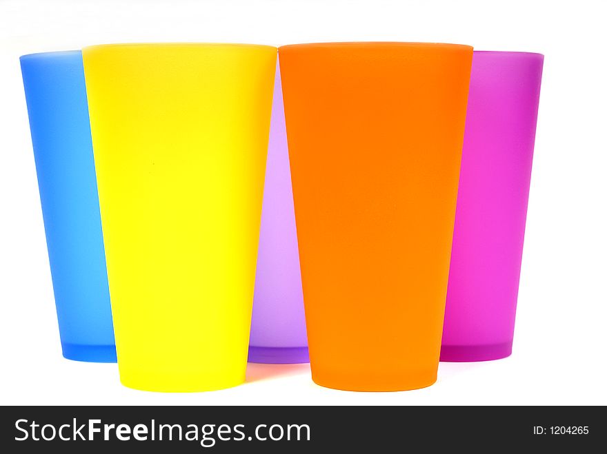 Five colorful beverage glasses front view. Five colorful beverage glasses front view