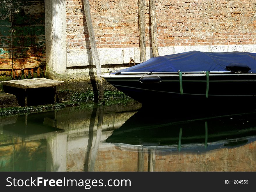 A picturesque back street canal in Venice. A picturesque back street canal in Venice.