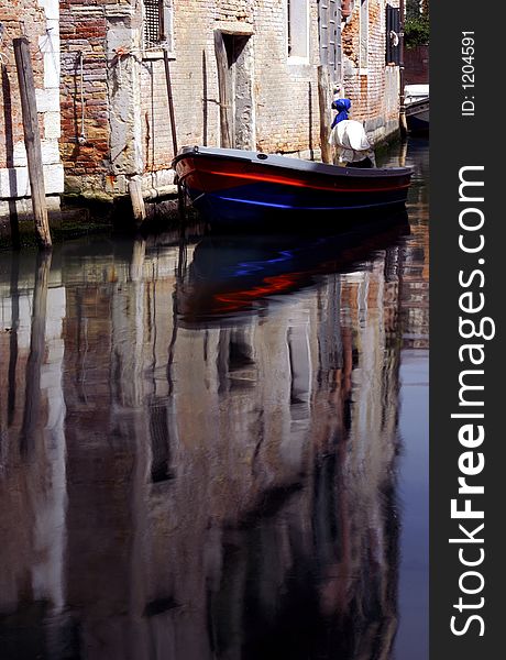 A lovely reflection from the coloured strips on the boat. A lovely reflection from the coloured strips on the boat.