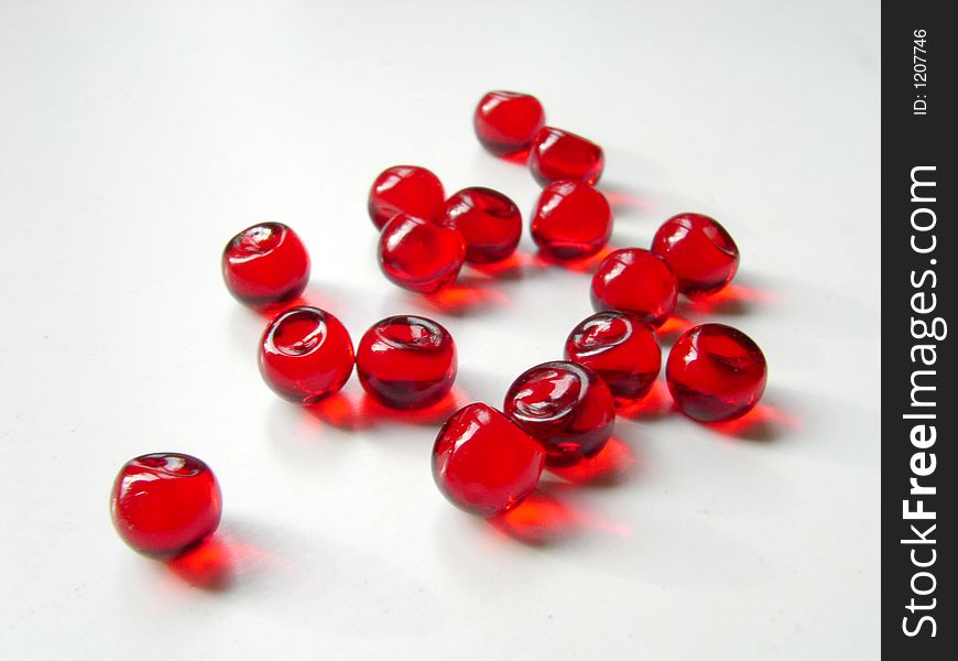 Small red round pills. Small red round pills