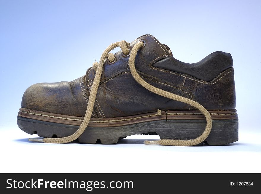 One children's old shoe with shoelace.