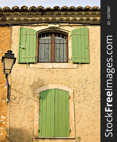 Colourful windows and doors at the village of Eyegalieres in France, with its colourful tinted walls