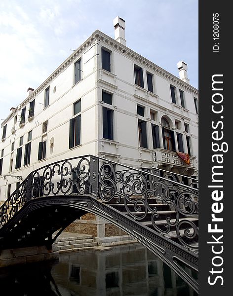 A fine iron bridge over a canal in Venice. A fine iron bridge over a canal in Venice.