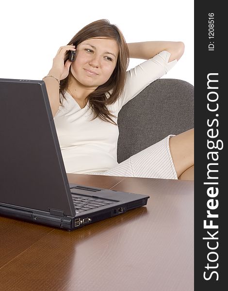 Isolated woman at the desk talking by mobile phone