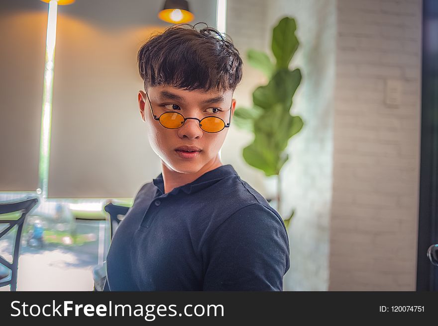 Portrait Photography Of Person Wearing Hippy Eyeglasses