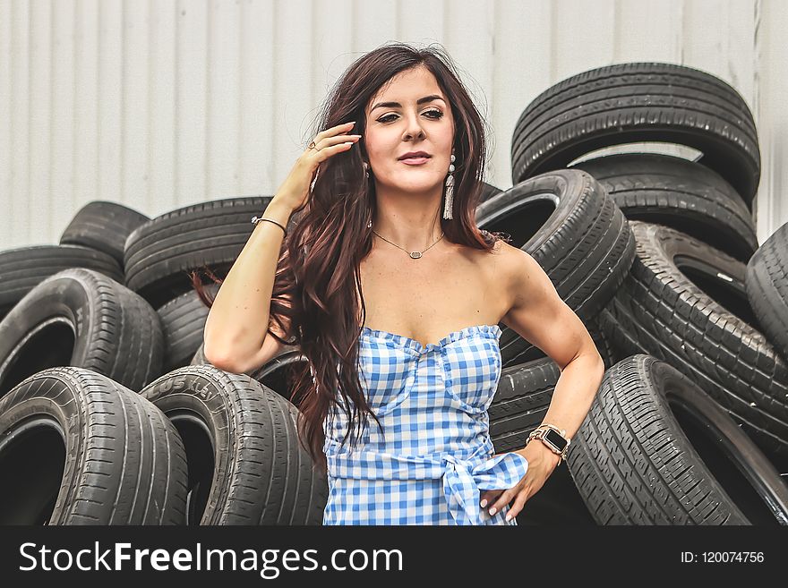 Woman Standing in Front of Car Tires