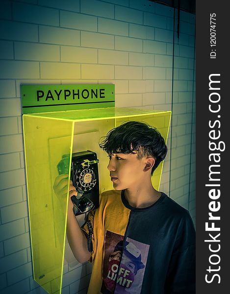 Boy holding Payphone receiver