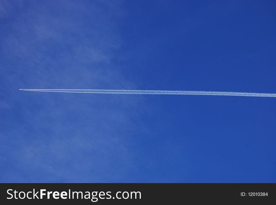 An airplane in the blue sky