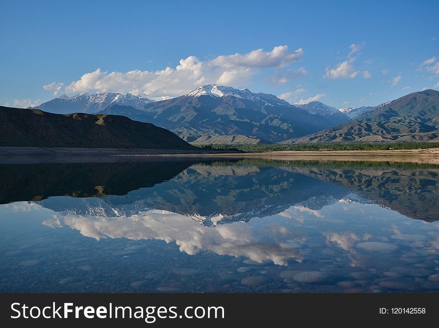 Reflective Photography Of Mountain