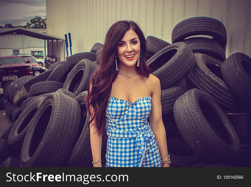 Woman Standing Behind Tires