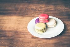 Colorful French Macarons On Wooden Background. Stock Photo Colorful French Macarons On Wooden Background. Stock Photo